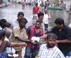 Parthiban doing Flood Relief Activities